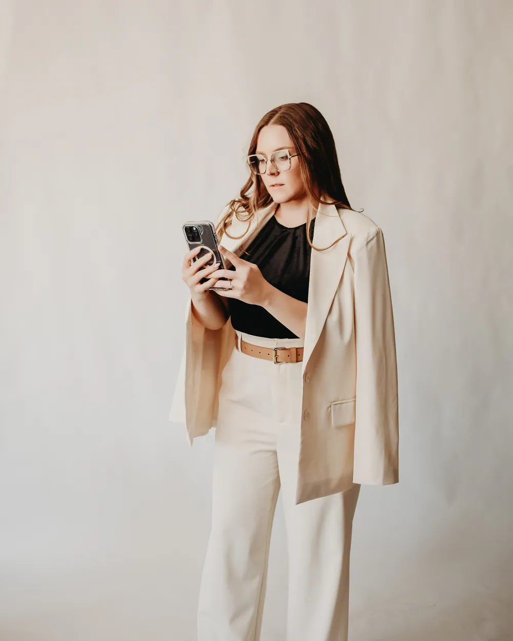 Andrea Wade, licensed Louisiana broker, in a cream suit