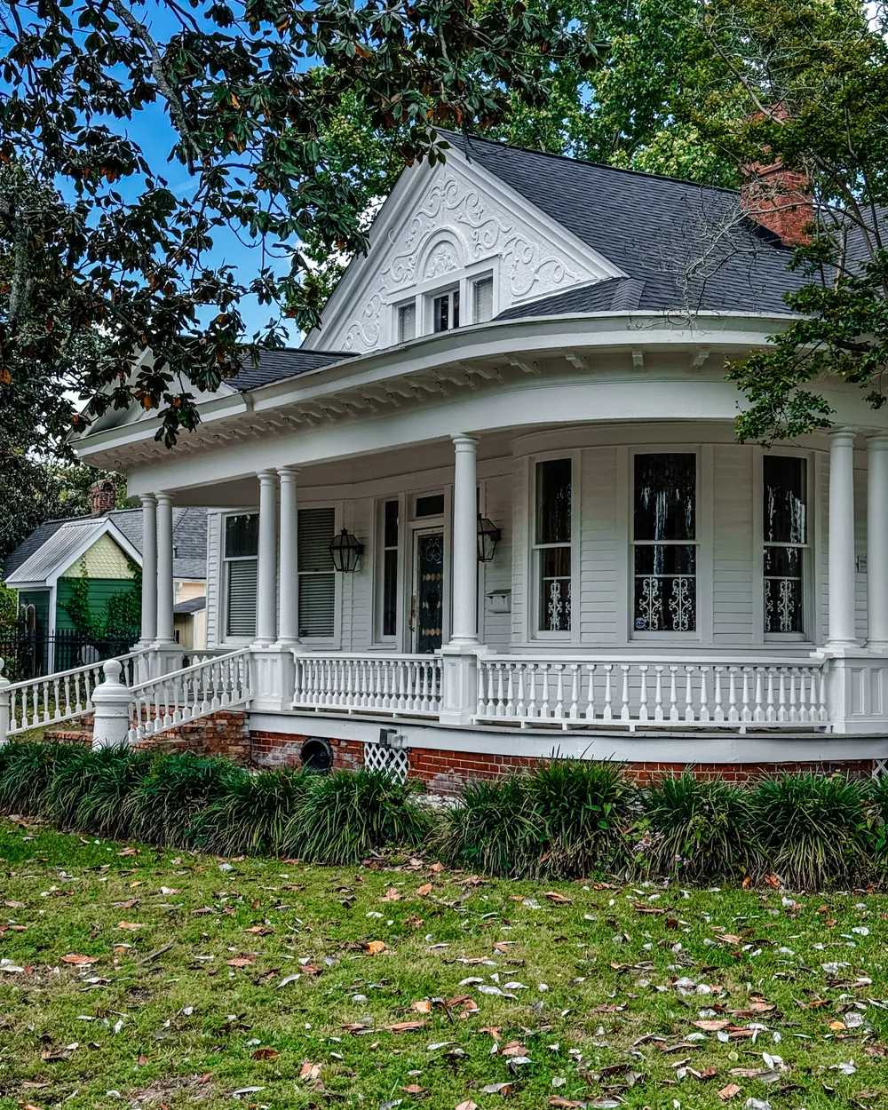 A white Louisiana home with a wraparound porch, Hammond
